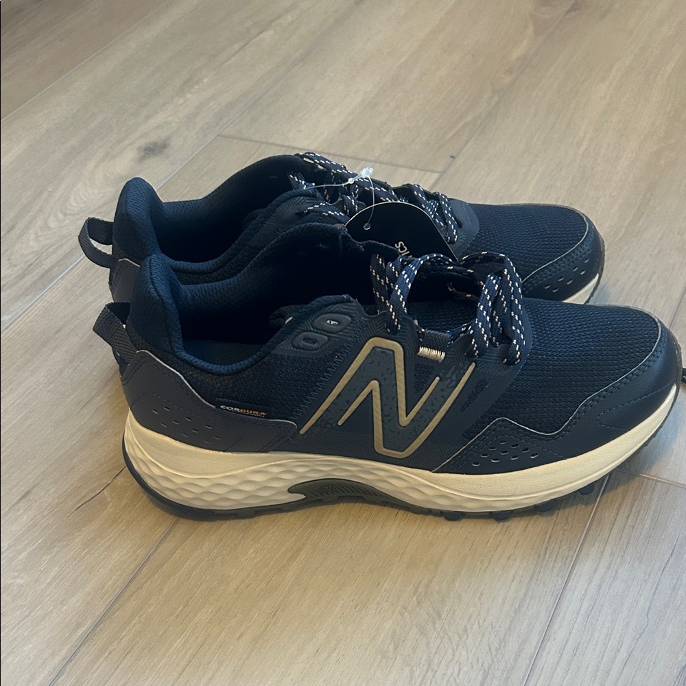 New Balance women’s Navy and Cream Athletic Shoes